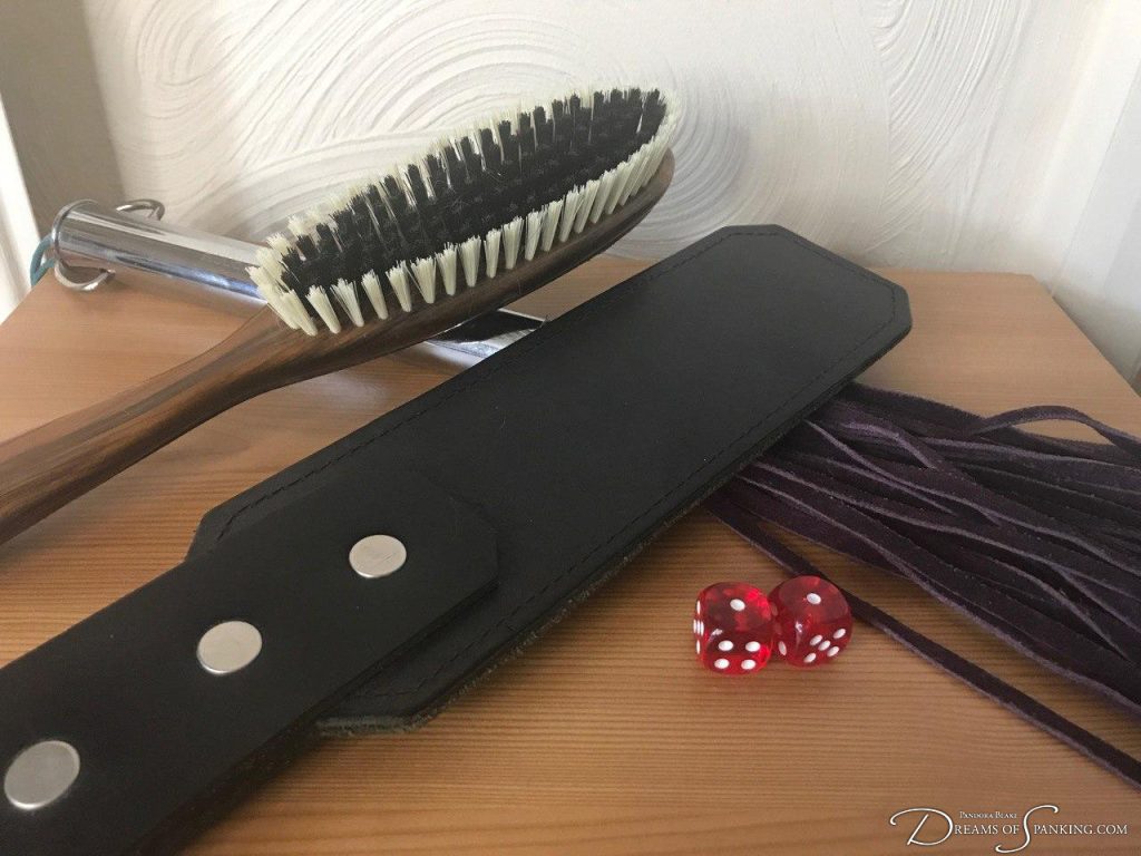 A set of spanking implements on a table