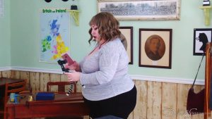 The headmistress inspects her phone