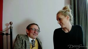 The two friends laugh together after the spanking