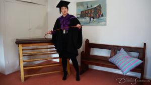Pandora stands in formal school dress holding a cane in their hands