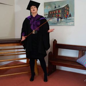 Pandora discusses your choice, wearing formal robes and holding a cane: the cane or foot worship