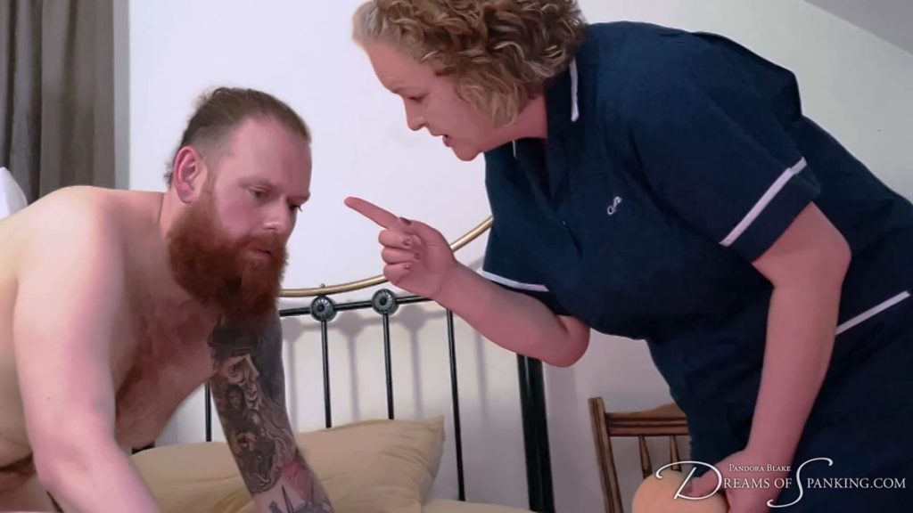 Jamie gets scolded by the matron as she wags a finger in his face