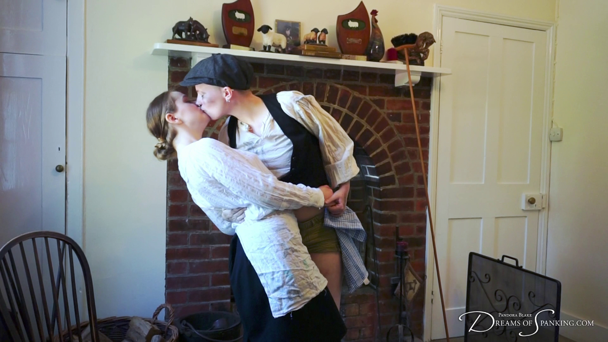 The maid and the chimney sweep kiss passionately in front of the fireplace