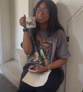 Denali looking pleased with themself enjoying their traditional cuppa on set