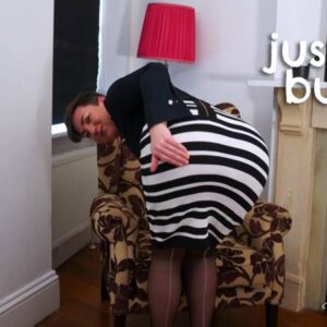 Blake bend over in their tight pencil skirt and looks back at the camera as they spank their bottom